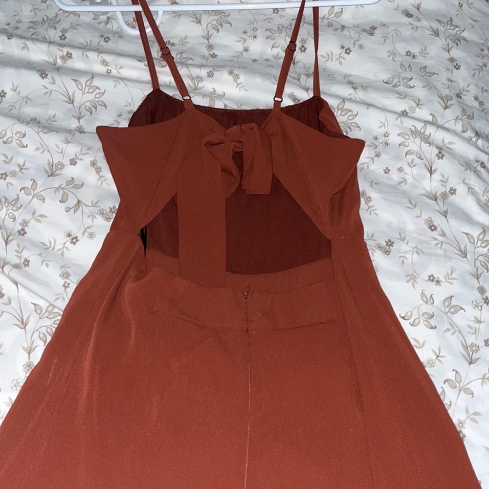 WHO I AM burgundy jumpsuit.